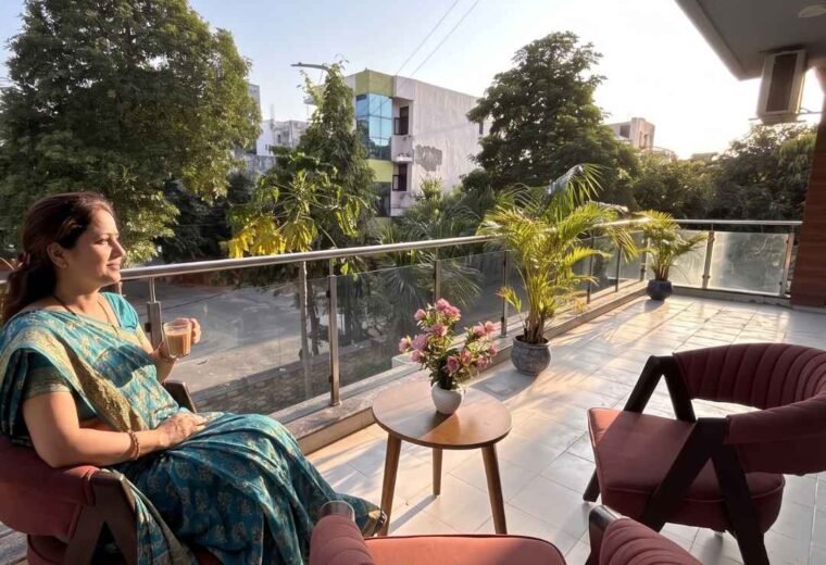 Guest relaxing in the balcony of Divine India Service Apartments