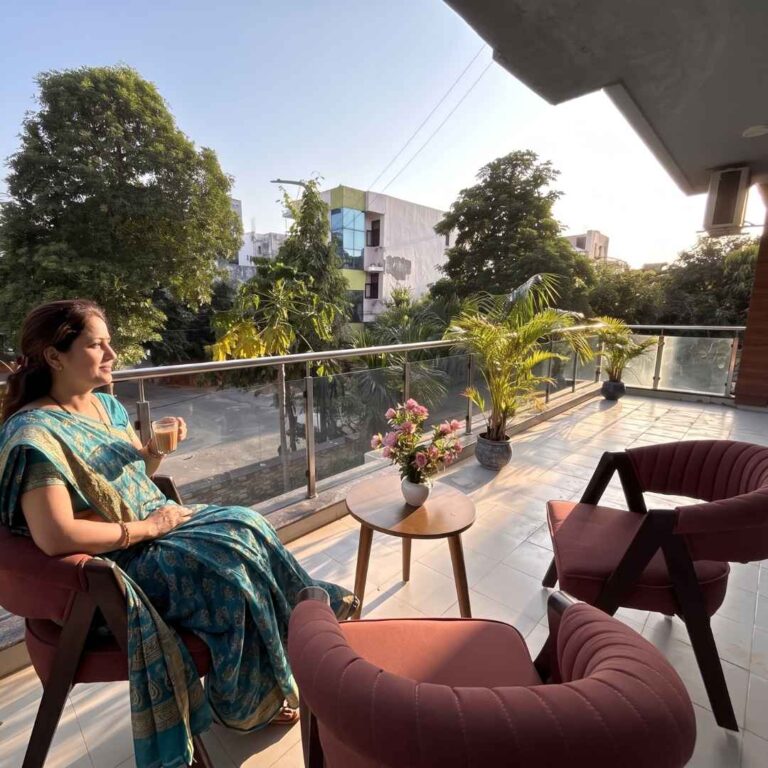 Guest relaxing in the balcony of Divine India Service Apartments